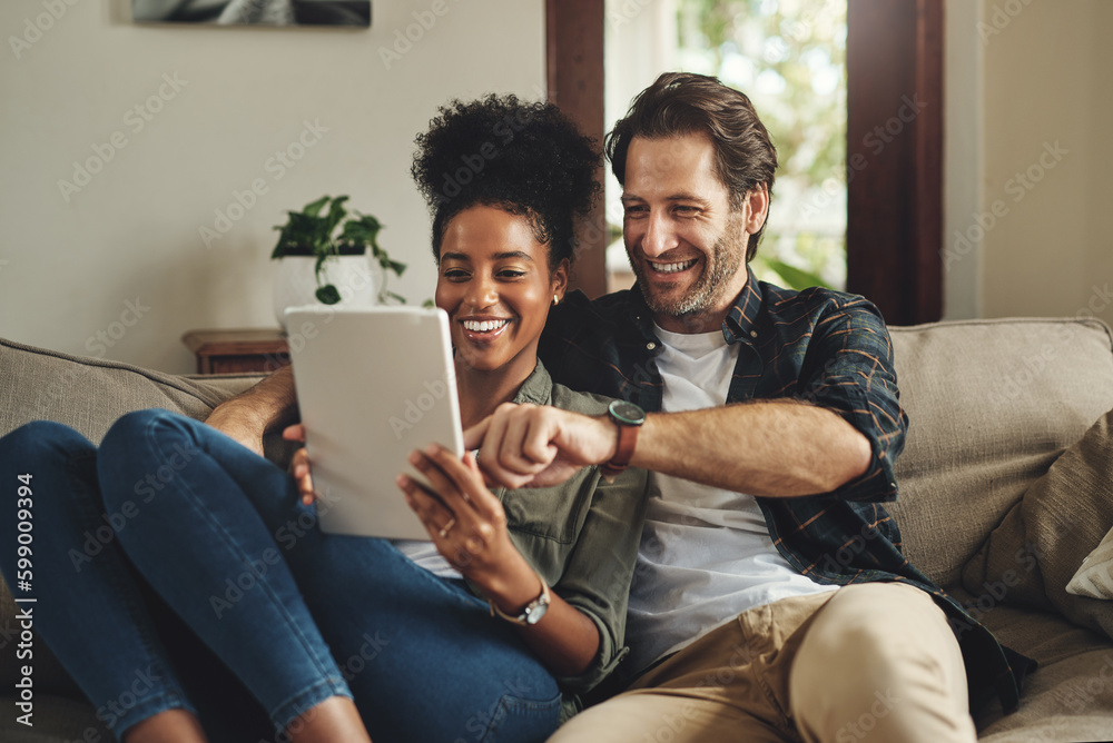 Wall mural there are so many apps to choose from. a happy young couple using a digital tablet together while re