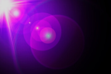 abstract background with glowing circles lens flare light on black background