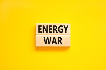Energy war symbol. Concept words Energy war on beautiful wooden block. Beautiful yellow table yellow background. Business and Energy war concept. Copy space.