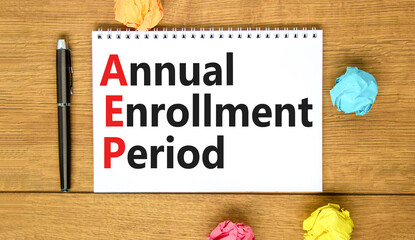AEP symbol. Concept words AEP Annual enrollment period on beautiful white note. Beautiful wooden...