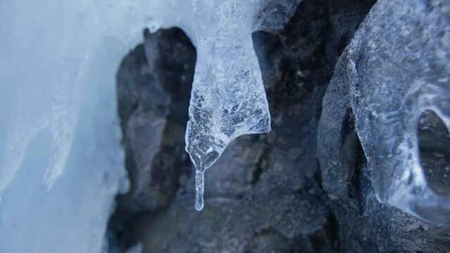 Macro shot of a stalactic frozen on rock, in the Alps, Switzerland