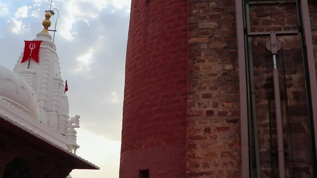 ancient temple with dramatic bright blue sunset sky at evening