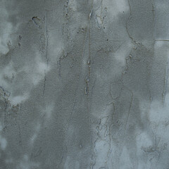 Texture of fresh concrete or cement wall on construction site. Gray wall of a house with a layer of...