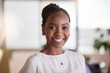 Beautiful young and successful. a beautiful young businesswoman in her office.