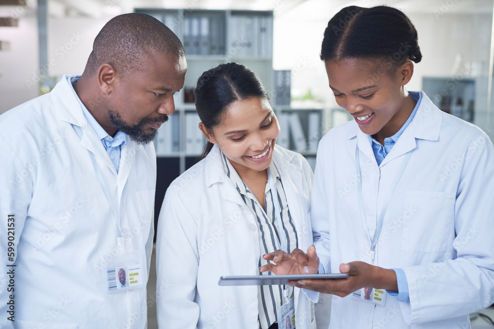 Poster They dont need mountains of paper to cure disease. a group of scientists using a digital tablet in a laboratory.