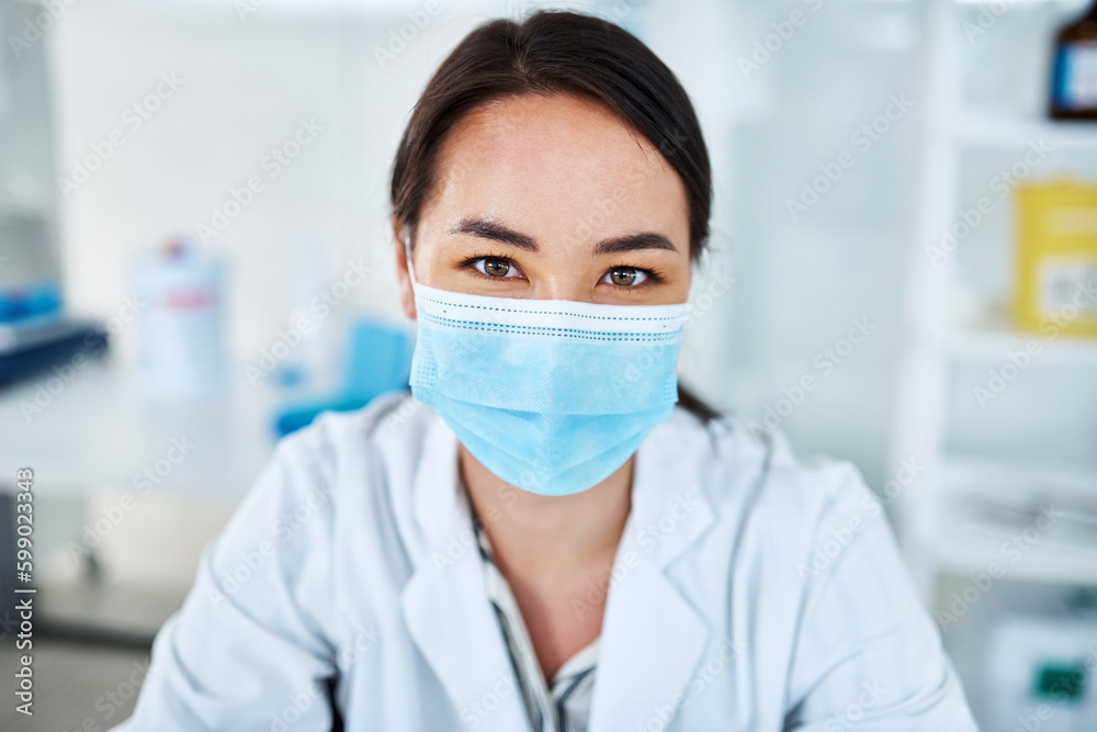 Poster Geared up and ready to get experimenting. Portrait of a young scientist in a lab.