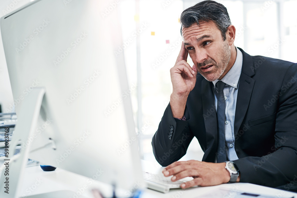 Poster stressis one of the biggest health hazards inthe workplace. a mature businessman looking stressed ou