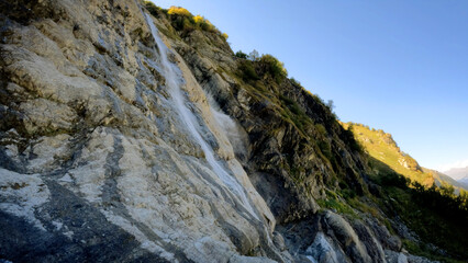 nice mountain ridge high land fast waterfall at summertime day - photo of nature