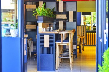 Cafe furniture bar counter and chairs. Open cafe view from the street.