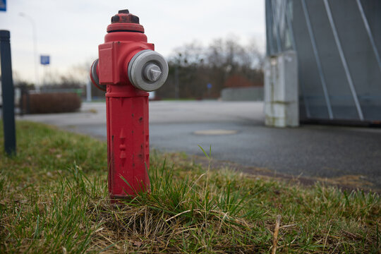 Old red fire hydrant in wroclaw poland street. Fire hidrant for emergency fire access
