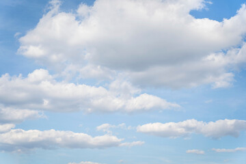 Fototapeta na wymiar White clouds on a blue sky background.