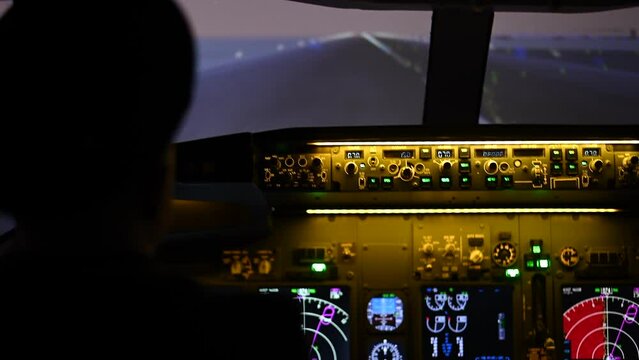 A man is studying to be a pilot in an aircraft simulator.  Generative AI