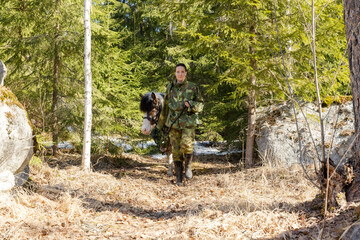 Camouflaged icelandic horse and woman in Finnish spring enviroment