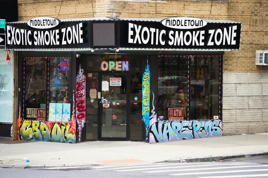 Bronx, NY - May 3 ,2023 : Middletown Exotic Smoke Zone storefront in New York City with graffiti decoration 