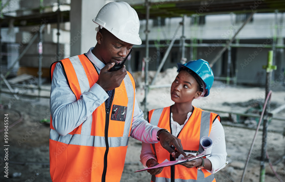 Poster Equal hands forge firm foundations. a young man using a walkie talkie while working with his colleague at a construction site.
