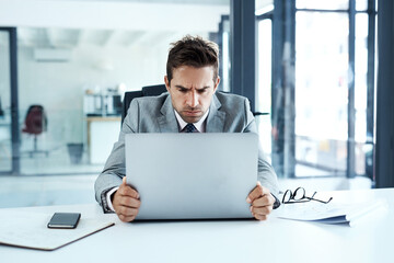 Why are you reconnecting again. a businessman looking irritated with his laptop.