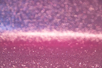 Hermoso fondo abstracto de luz brillante y purpurina. Fondo de luces de purpurina rosa y purpura. Desenfocado y enfoque suave. © C.Castilla