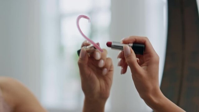 Woman hand drawing lipstick heart bathroom mirror closeup. Lady putting symbol Generative AI