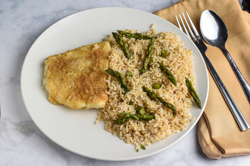 baked cod  with brown rice  and asparagus - obrazy, fototapety, plakaty