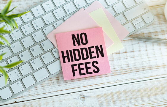 No hidden fees text on paper on the chart background with keyboard.