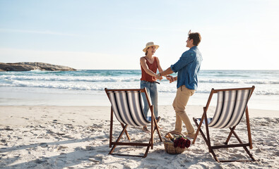 Were exactly where were supposed to be. a middle aged couple dancing on the beach.