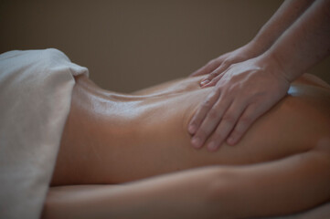 Photographs of massage and bodywork. Male therapist working on female client.  - 599055179