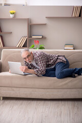Old man working from home during pandemic
