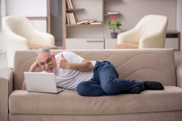 Old man sitting at home