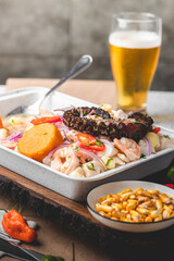 Peruvian traditional food ceviche with fish, red onions, sweet potatoes and red peppers. 