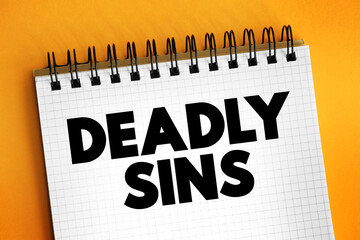 Deadly sins text on notepad, concept background