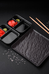 Pickled ginger, soy sauce and wasabi in portioned plastic containers