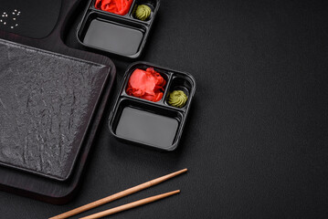 Pickled ginger, soy sauce and wasabi in portioned plastic containers