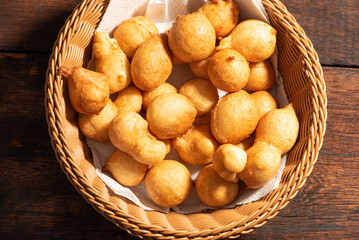 Raincake, basket with raincakes over rustic wood top view, selective focus.