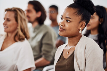 Seminars are meant to inspire and motivate attendees. a young businesswoman attending a conference.