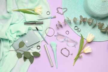 Composition with stylish female accessories, cosmetics, tulip flowers and eucalyptus branches on color background