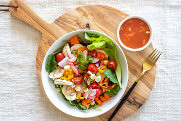 Fresh healthy salad with homemade citrus dressing