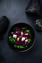 Green salad with boiled beets, arugula, feta cheese and walnuts.