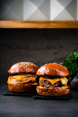 American food beef and chicken burgers with cheddar cheese, pickled cucumbers, tomatoes and ketchup...