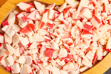 Tasty chopped crab sticks on plate, closeup © Pixel-Shot
