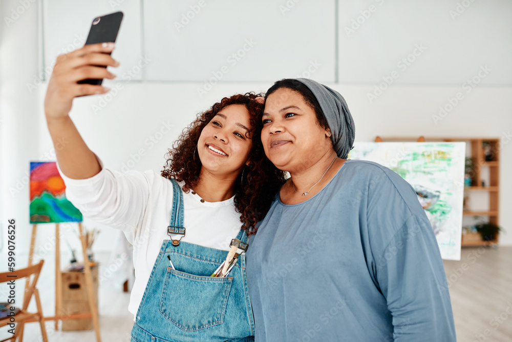 Poster lets take a selfie. two attractive young women standing and using a cellphone to take a selfie durin