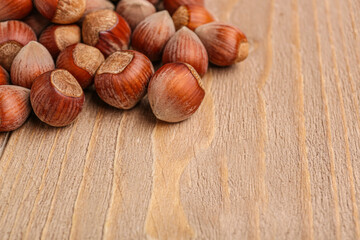 Shelled hazelnuts on wooden background