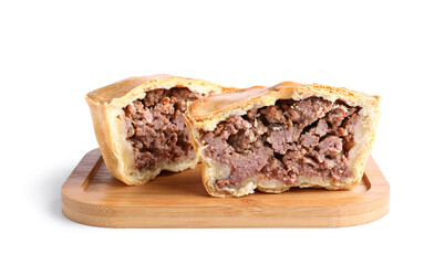 Wooden board with cut meat pot pie on white background