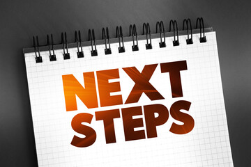 Next Steps text on notepad, concept background