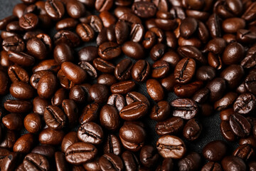 Coffee beans on dark background, closeup