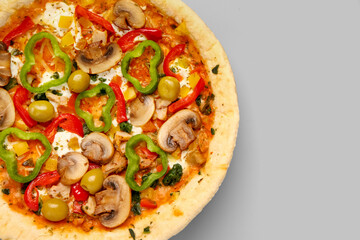 Vegetable pizza on grey background