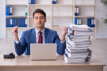 Young male employee working in the office