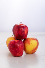 group of organic red apples in white background