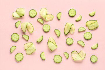 Slices of cucumber on pink background
