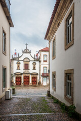 Street view of the city of Mirandela in Portugal with the Misericórdia Church in the background.