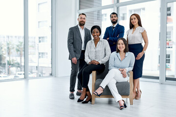 Great teams are filled with determined individuals. Portrait of a group of businesspeople posing...